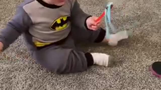 Cute Little baby plays with cat