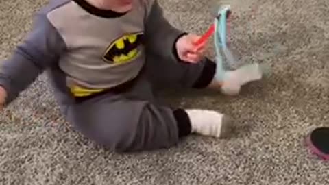 Cute Little baby plays with cat