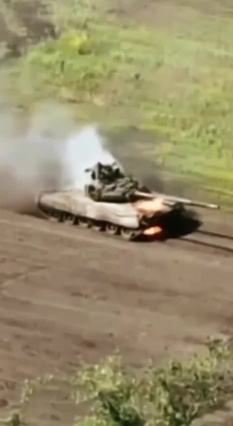 Russians Drive Around in Burning Tank