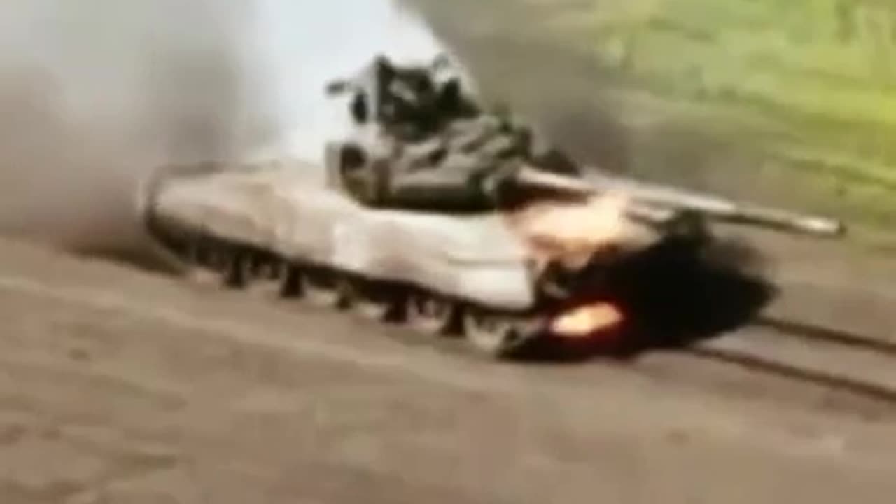 Russians Drive Around in Burning Tank