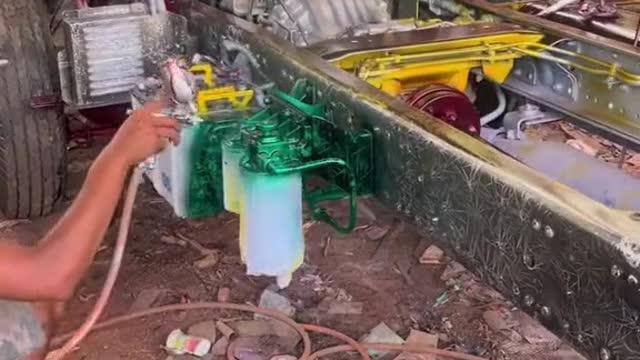 The repairman spray-painted the surface configuration of the truck
