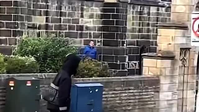 Video recorded in Huddersfield, England yesterday shows a person using a long blade to attack a man