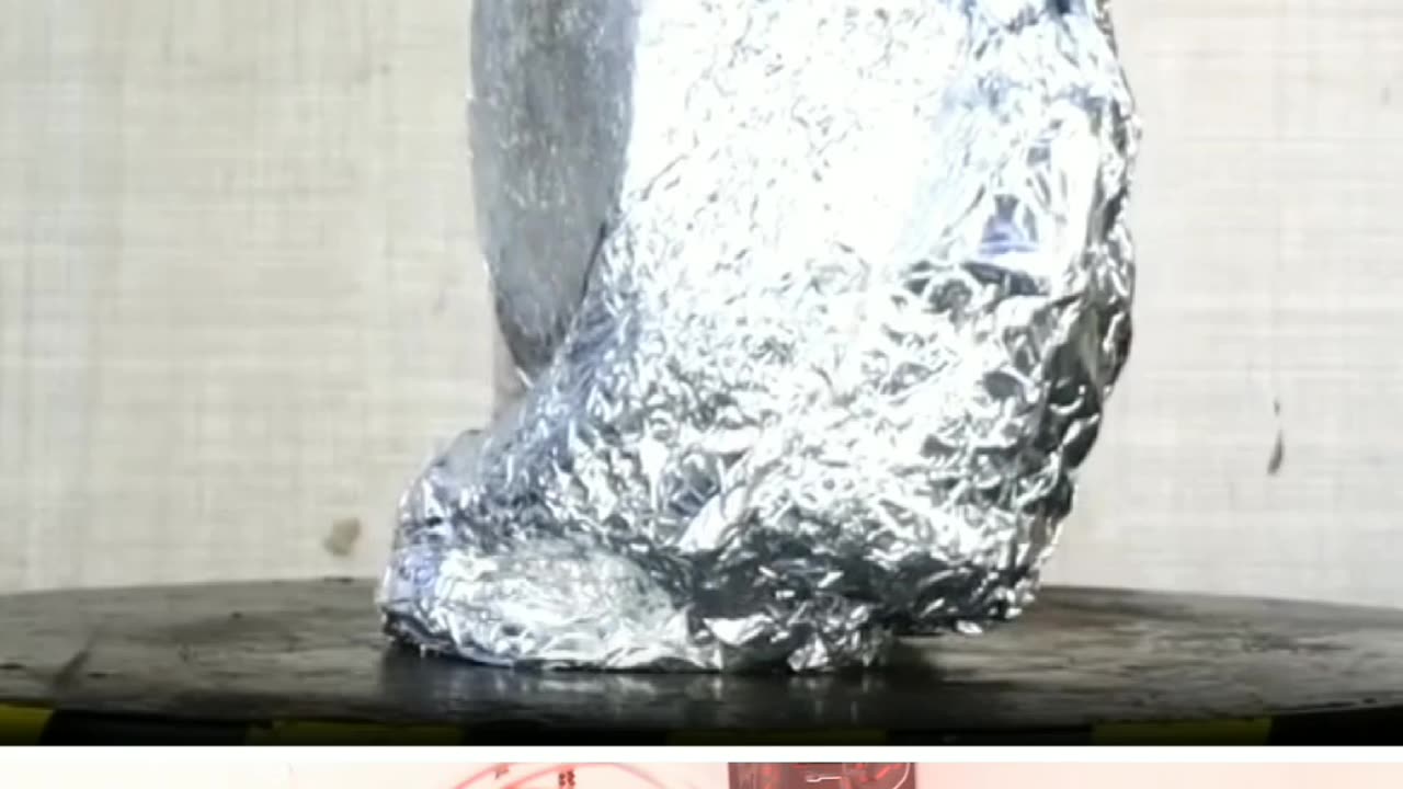 Alluminium foil under Hydraulic press gone crushed