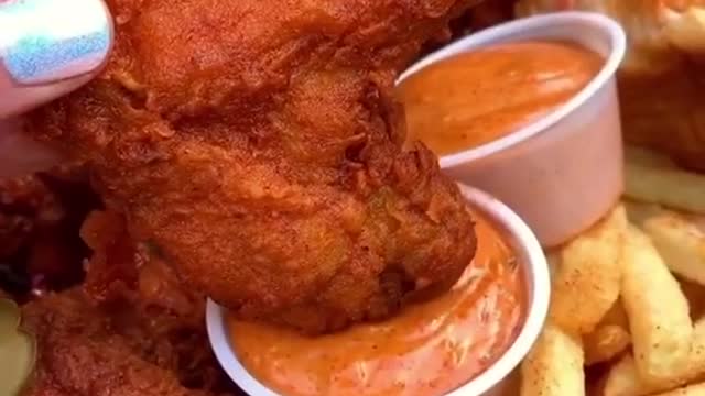 Fried chicken with salad dressing and French fries are delicious