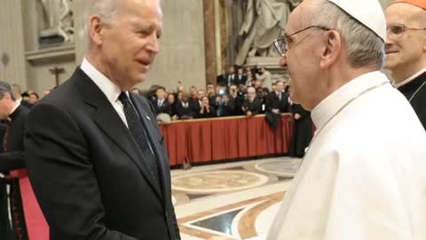 Biden having a discussion with the Pope