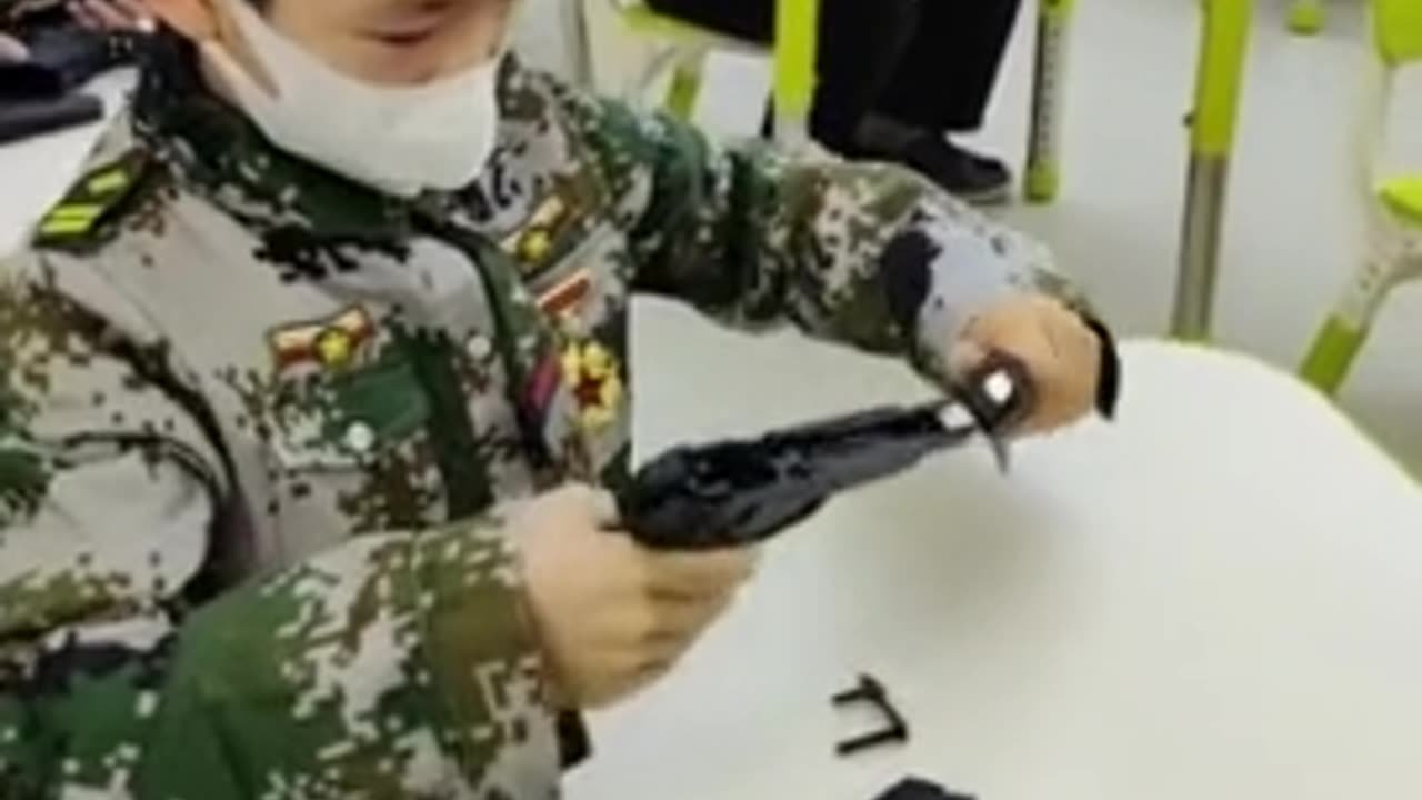 China teaches children to assemble a gun