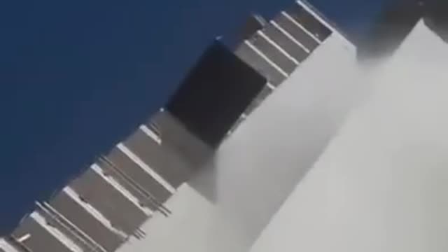 rocket hits buildings and man falls