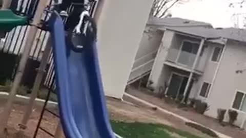 Nsfw kid rides white bike down slide cuts head open playground