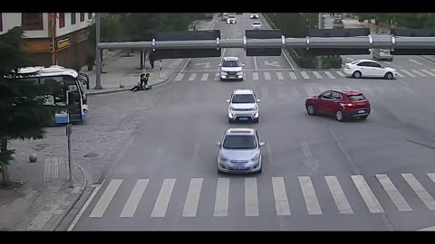 Viral: Overworked China Traffic Cop Collapses In Street