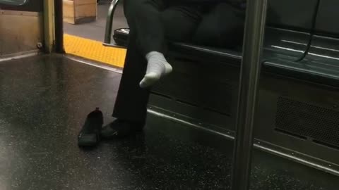 Well that sox woman wears white socks on train