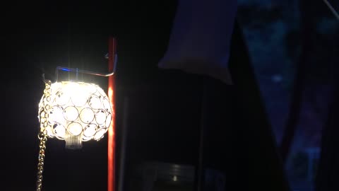 A lamp shining on a dark night 2