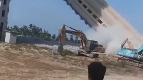 Demolition building goes down