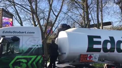 Just Stop Oil protesters scale fuel tanker in west London to block M4 access