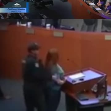 Woman put in handcuffs at city council meeting
