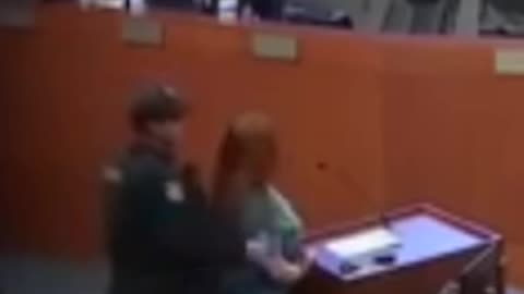 Woman put in handcuffs at city council meeting