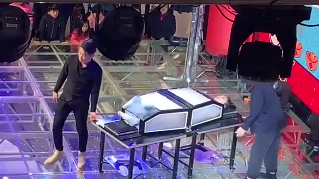 Sawing a girl in half magic trick