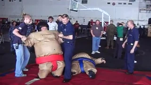 SUMA wrestling my son John aboard the USS Ronald Reagan 76