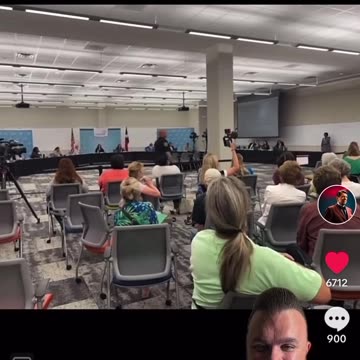 Concerned Citizen reads book during school board meeting.... WTF?!