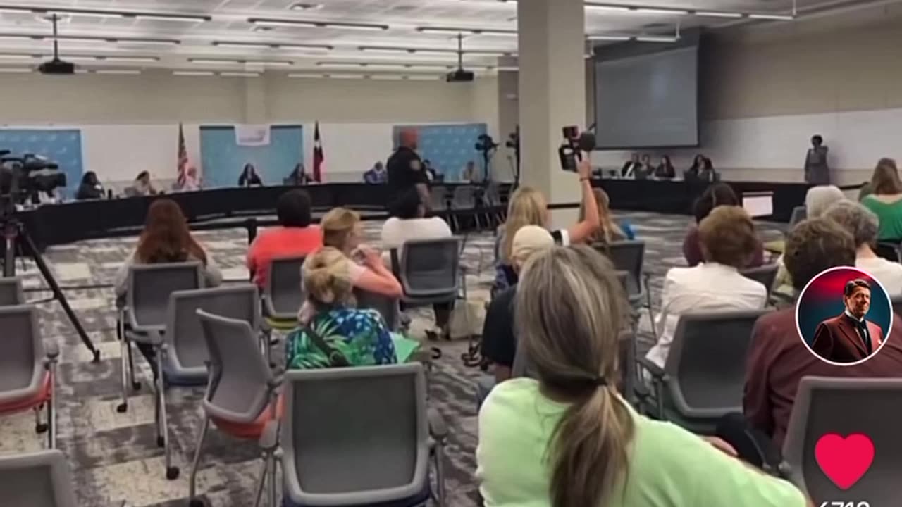 Concerned Citizen reads book during school board meeting.... WTF?!