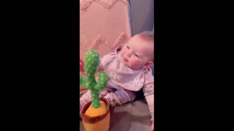 Baby has adorable conversation with talking cactus toy