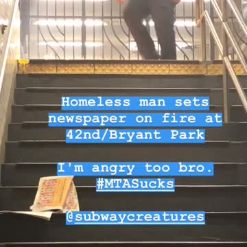 Police officer putting out fire top of stairs