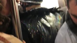 Man dressed in black and silver sparkle outfit