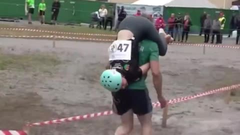 Wife carrying competition winner get wife's weight in beer