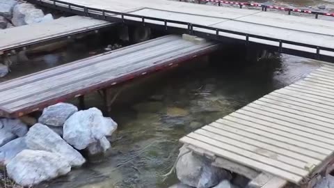 NE Tennessee residents and volunteers built a temporary bridge from semi-trailers to aid recovery.