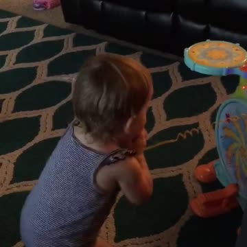 Baby rocks out to daddies drumming