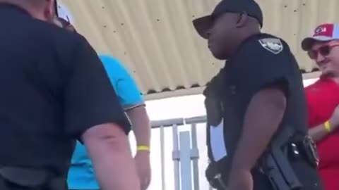 Racist cop beats fan in stadium