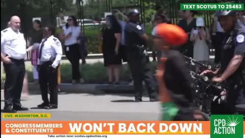 Is Ilhan Omar also pretending to be handcuffed?!!