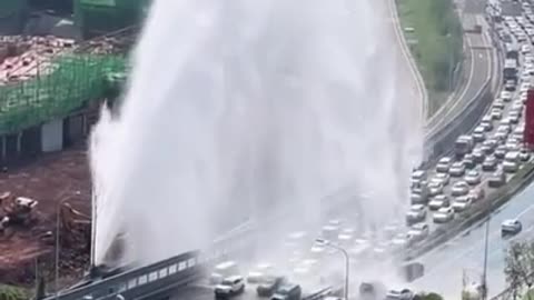 Exploding Water Pipeline On the Side of the Highway