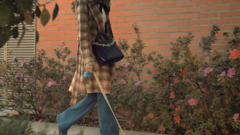 Woman with face mask walking with her dog