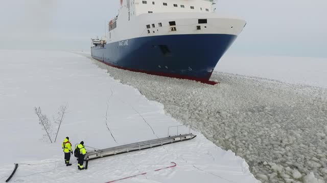 Experienced Pilot Boards Onto A Moving Ship With Ease