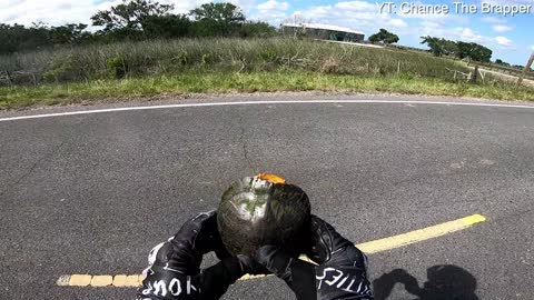 Motorcycle Rider Assists Turtle Across Busy Road