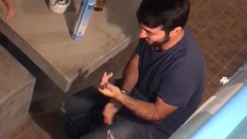 Man uses fire torch to kill a roach