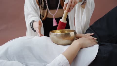 A Person Using Singing Bowl