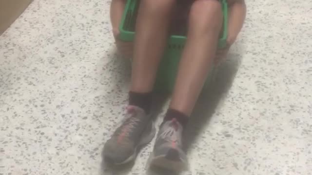 Boy in shopping basket