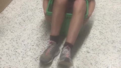 Boy in shopping basket