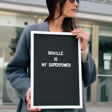 Woman Holding Board with a Message