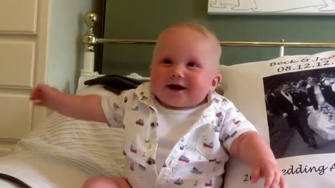 A cute baby laughing