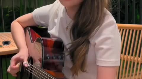 Beautiful girl play giter
