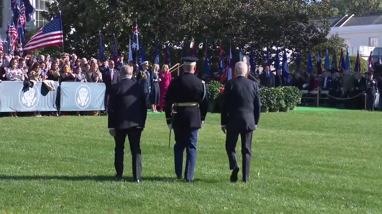 A confused Biden shuffles across the White House lawn with the Australian prime minister