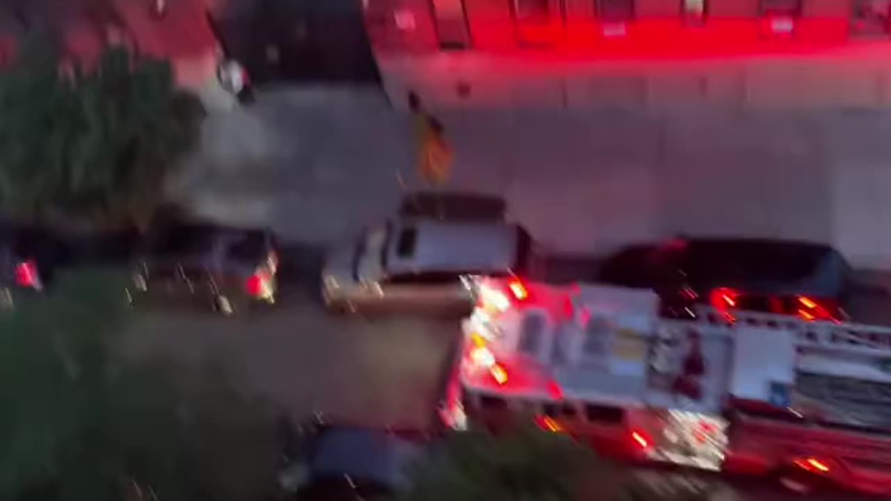 Double parked car blocking firefighters