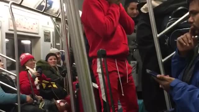 Dancer in red outfit performs on subway train, "can't stop the feeling" justin timberlake