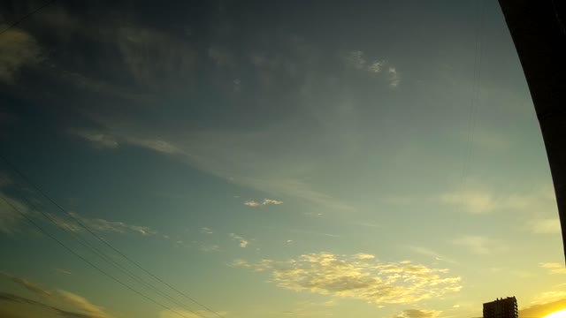 Time-lapse of clouds at sunset