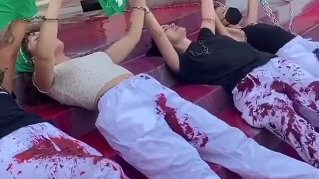 Pro Abortion Activists Pour “Blood” on the Steps Of La City Hall And Lay Down In It