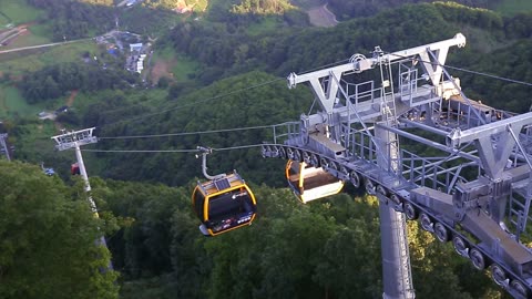 a cable car moving on a mountain