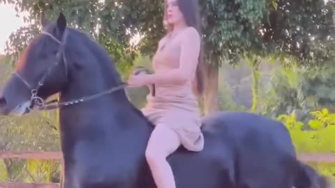 The horse is happy to carry this horsewomen