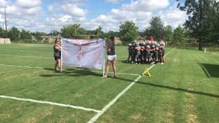 Tough Football Banner Prevents Team Entrance